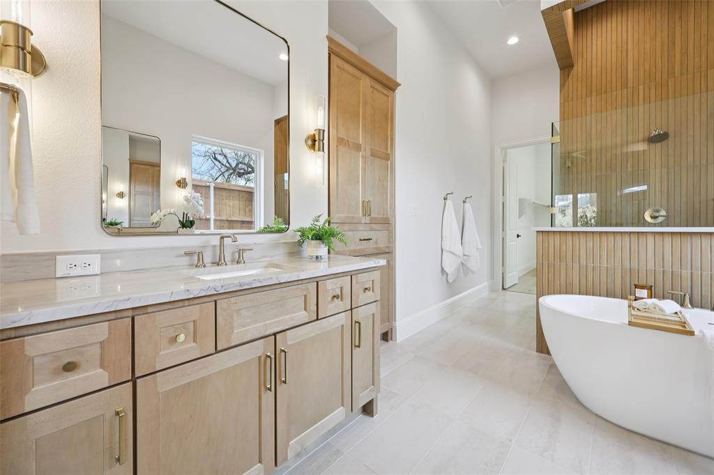 3845 Van Ness Lane Dallas, TX 75220 - Photo 22 of 33 Full bath with vanity, a freestanding bath, light tile patterned floors, and walk in shower