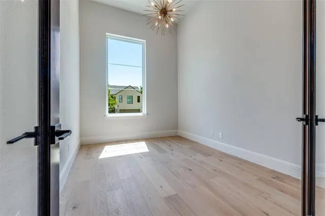 a view of front door with wooden floor