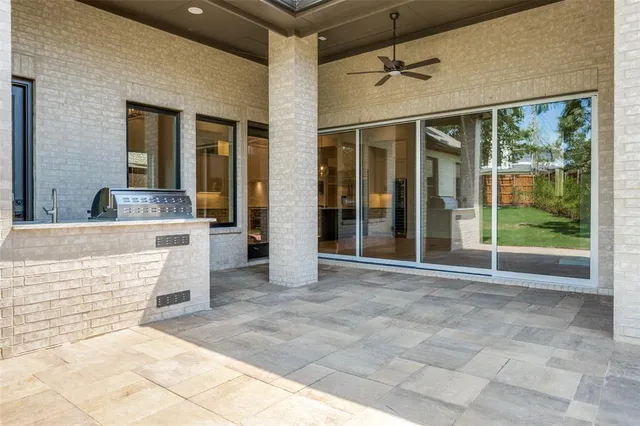 a bathroom with a sink and two mirror