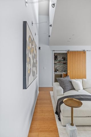 a kitchen with stainless steel appliances granite countertop a sink a stove a dining table and chairs