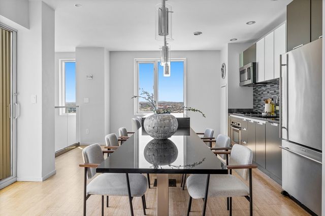a kitchen with lots of counter top space and stainless steel appliances
