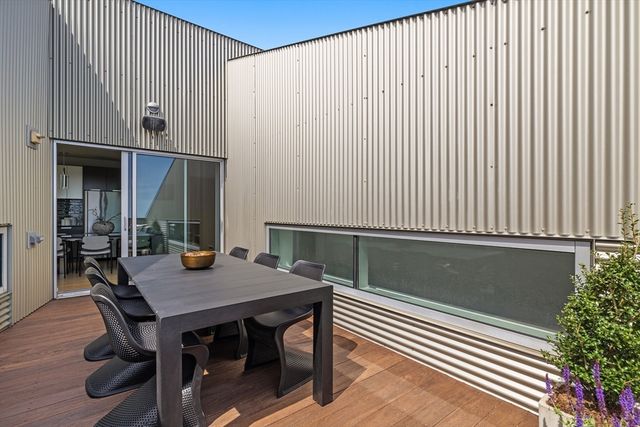 a view of balcony with furniture