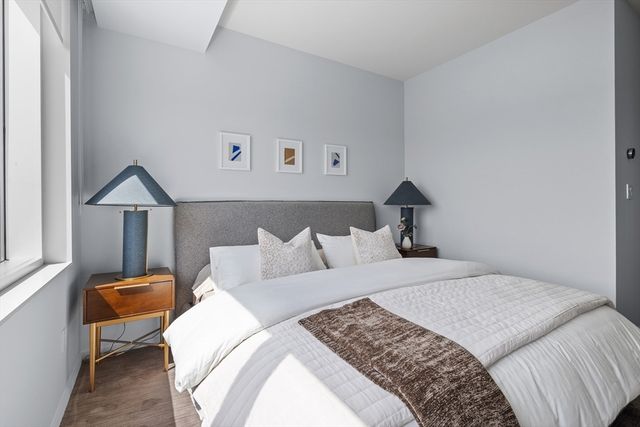 a bedroom with a bed and window