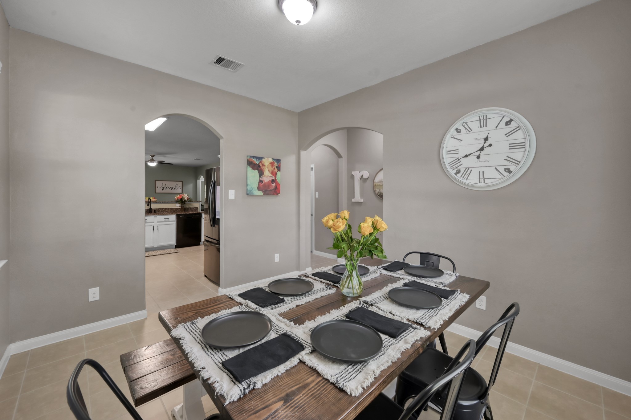 7562 Fettle Lane Conroe, TX 77304 - Photo 9 of 30 Open-concept dining space offering comfortable everyday living and gatherings.