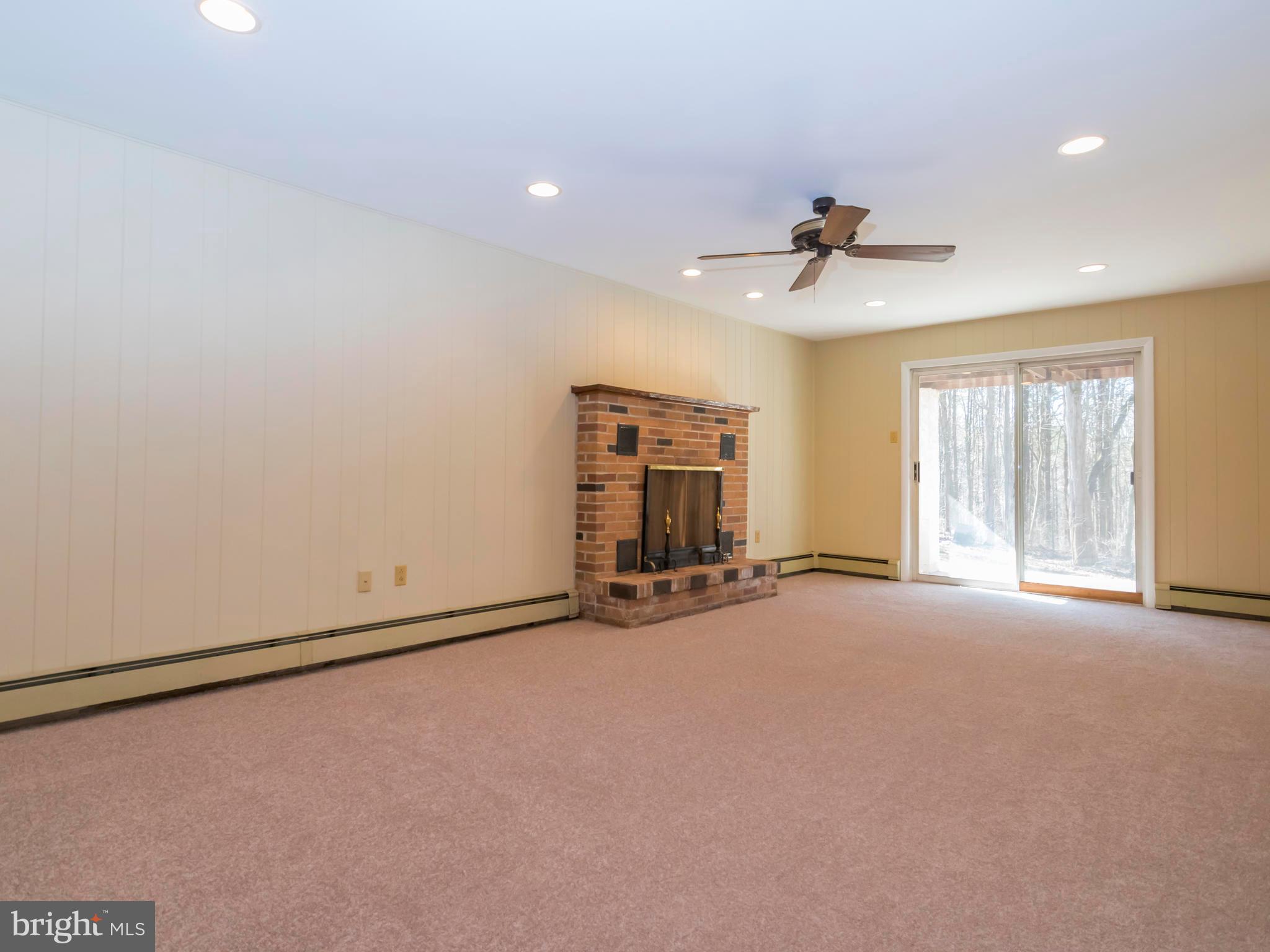 3050 Wonziegler Road Pennsburg, PA 18073 - Photo 19 of 31 Lower level family room with fire place