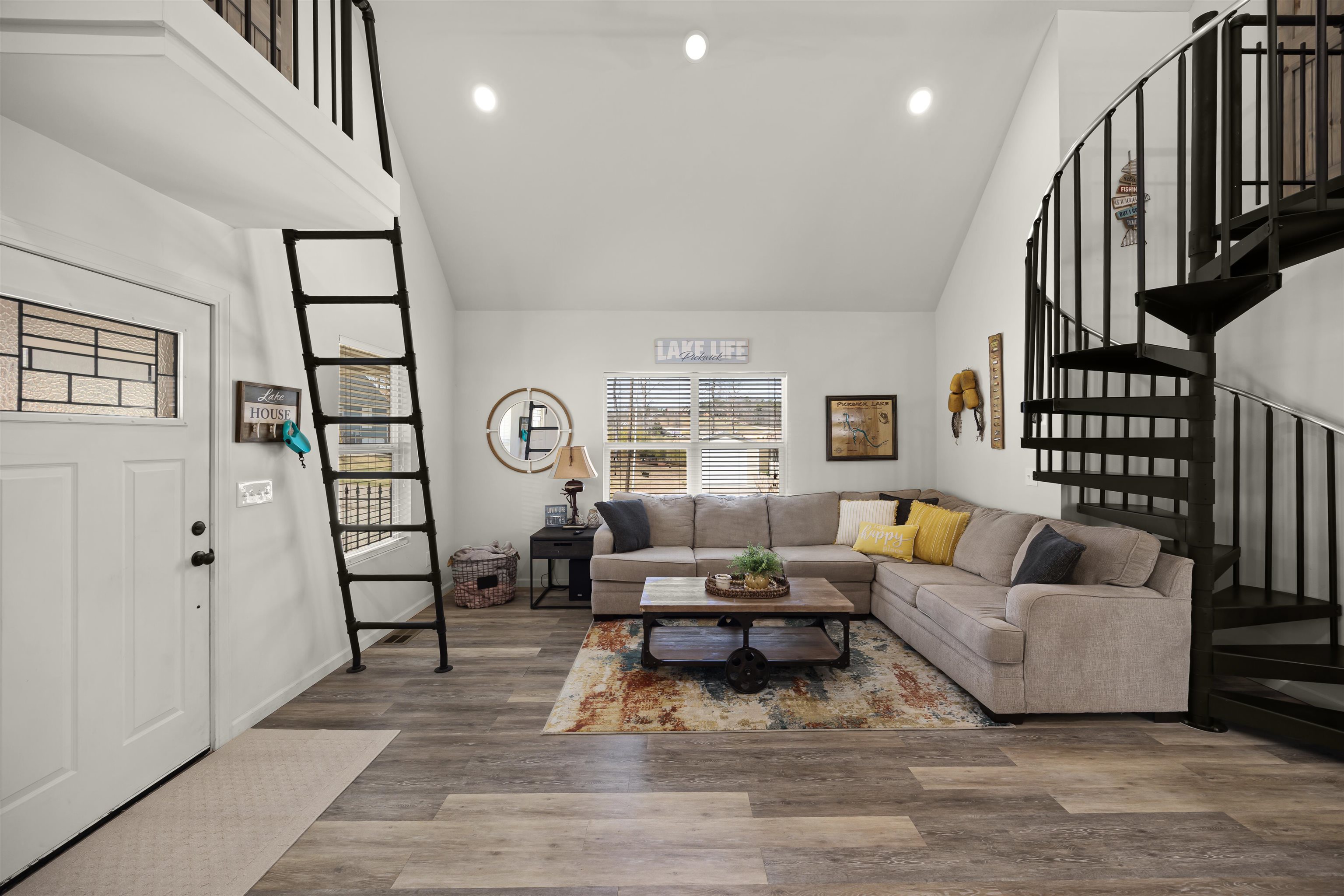 15 Bogey Loop Counce, TN 38326 - Photo 7 of 17 Living room featuring recessed lighting, high vaulted ceiling, stairway, and wood finished floors