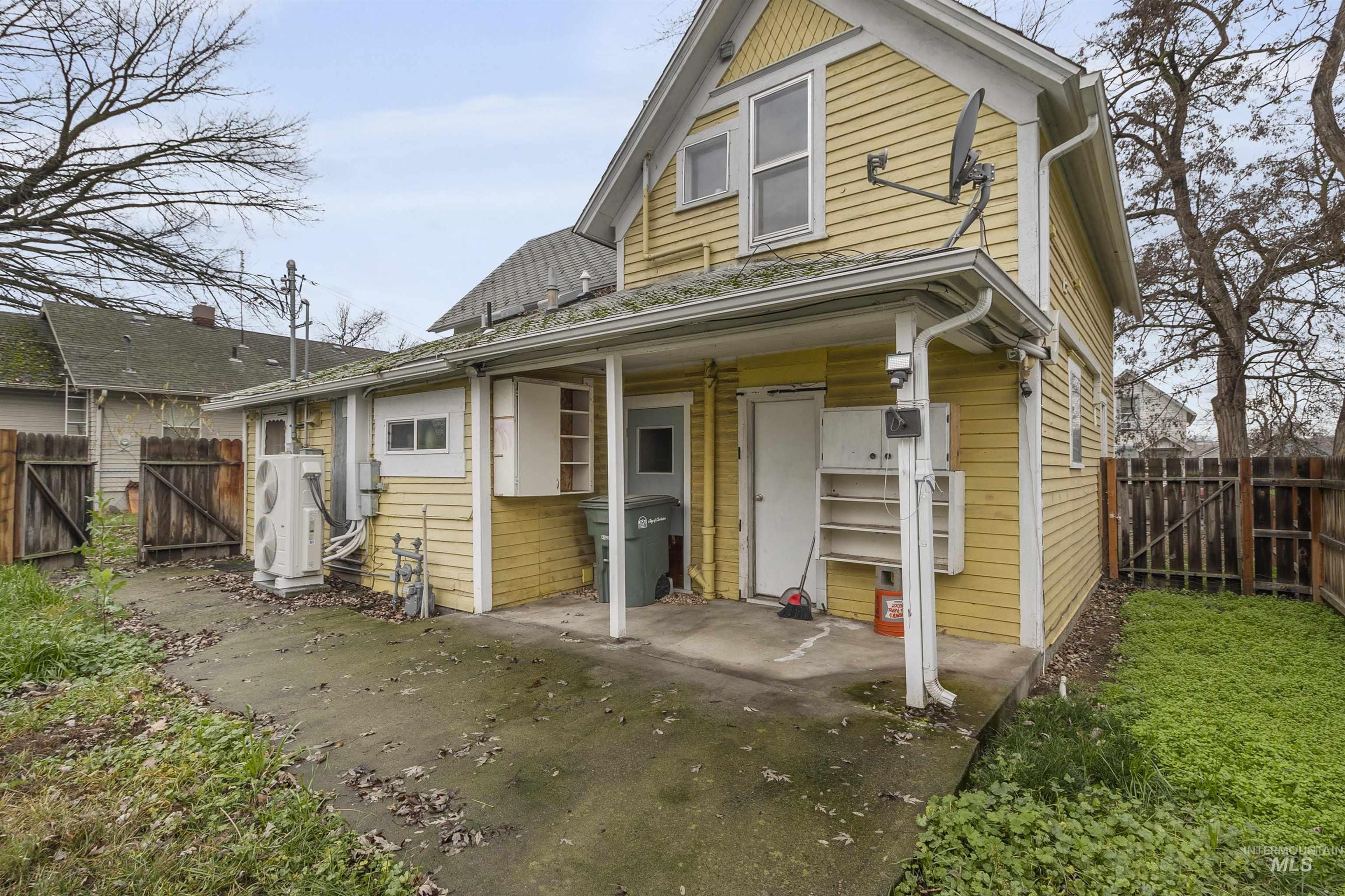 721 9th Street Clarkston, WA 99403 - Photo 2 of 39 View of front of property with a gate, a fenced backyard, and a patio area