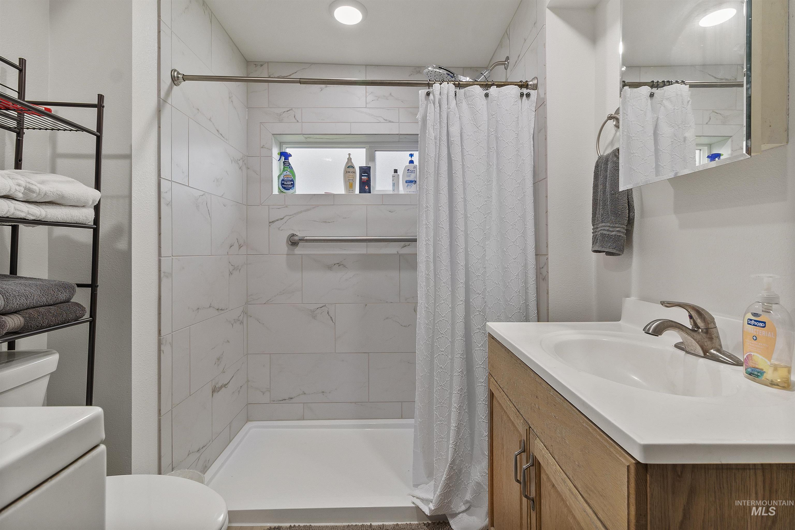 721 9th Street Clarkston, WA 99403 - Photo 23 of 39 Full bath featuring vanity and a stall shower