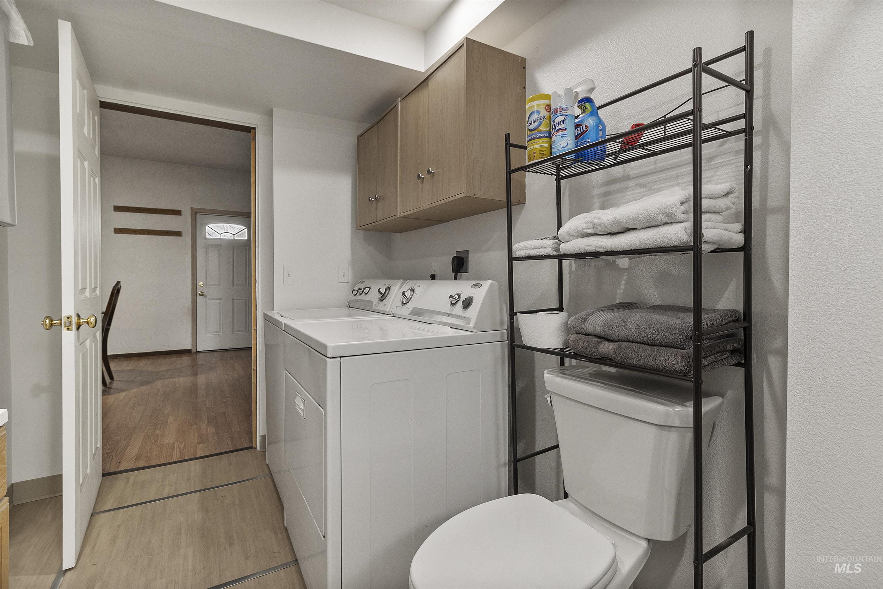 721 9th Street Clarkston, WA 99403 - Photo 25 of 39 Laundry room featuring washer and dryer and light wood finished floors