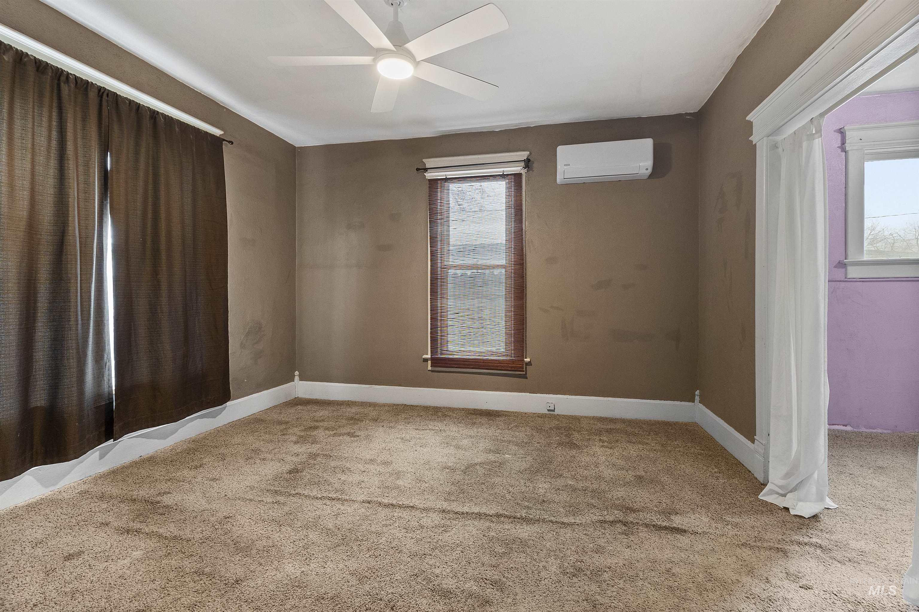 721 9th Street Clarkston, WA 99403 - Photo 26 of 39 Empty room with light carpet and ceiling fan