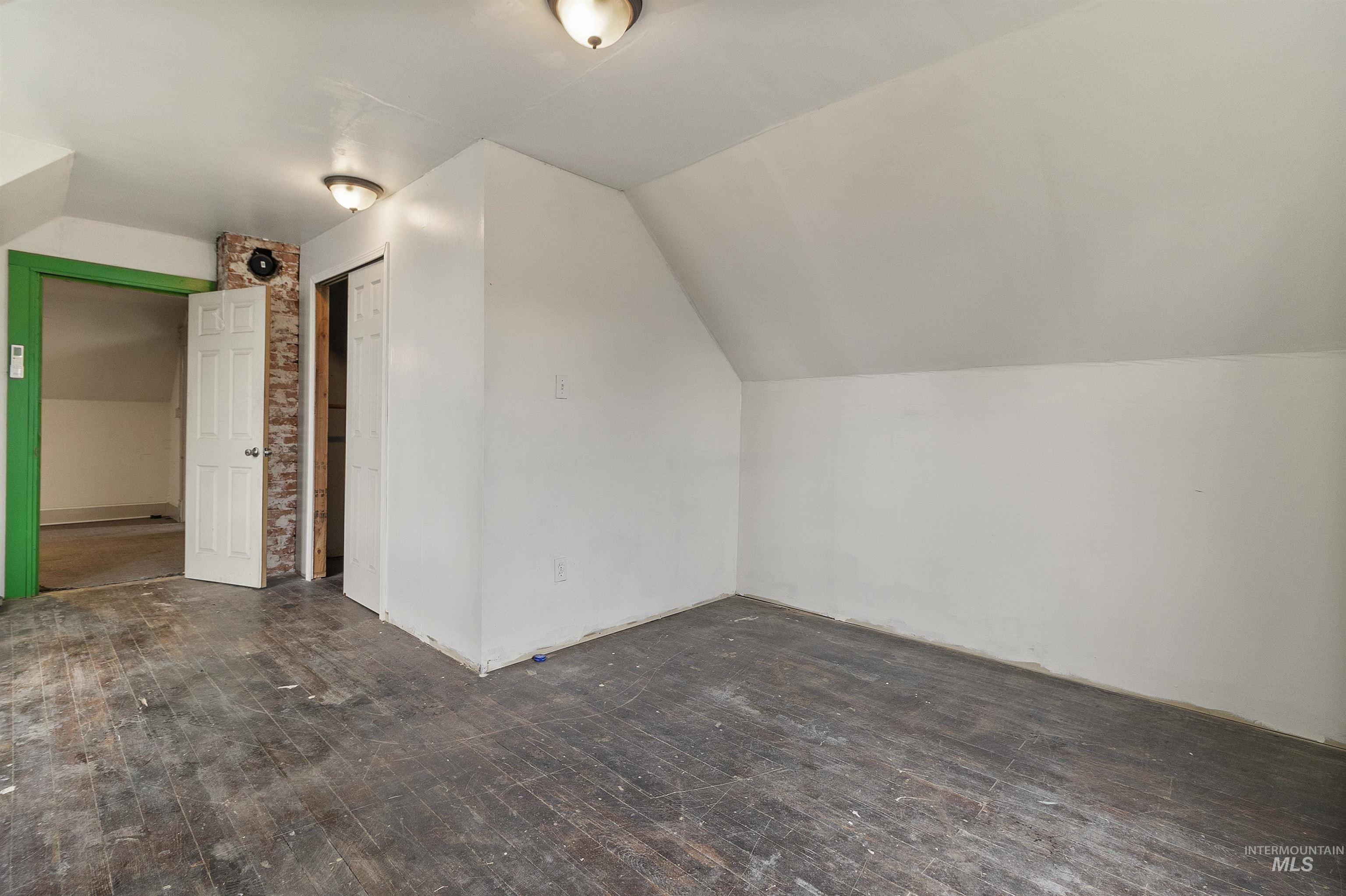 721 9th Street Clarkston, WA 99403 - Photo 37 of 39 Bonus room featuring lofted ceiling and dark wood-style floors