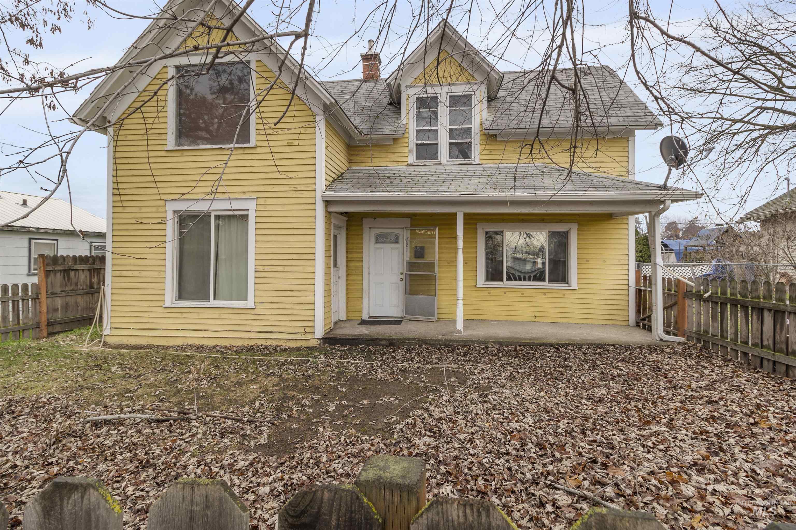 721 9th Street Clarkston, WA 99403 - Photo 4 of 39 View of front of property featuring a fenced backyard, a porch, and a chimney