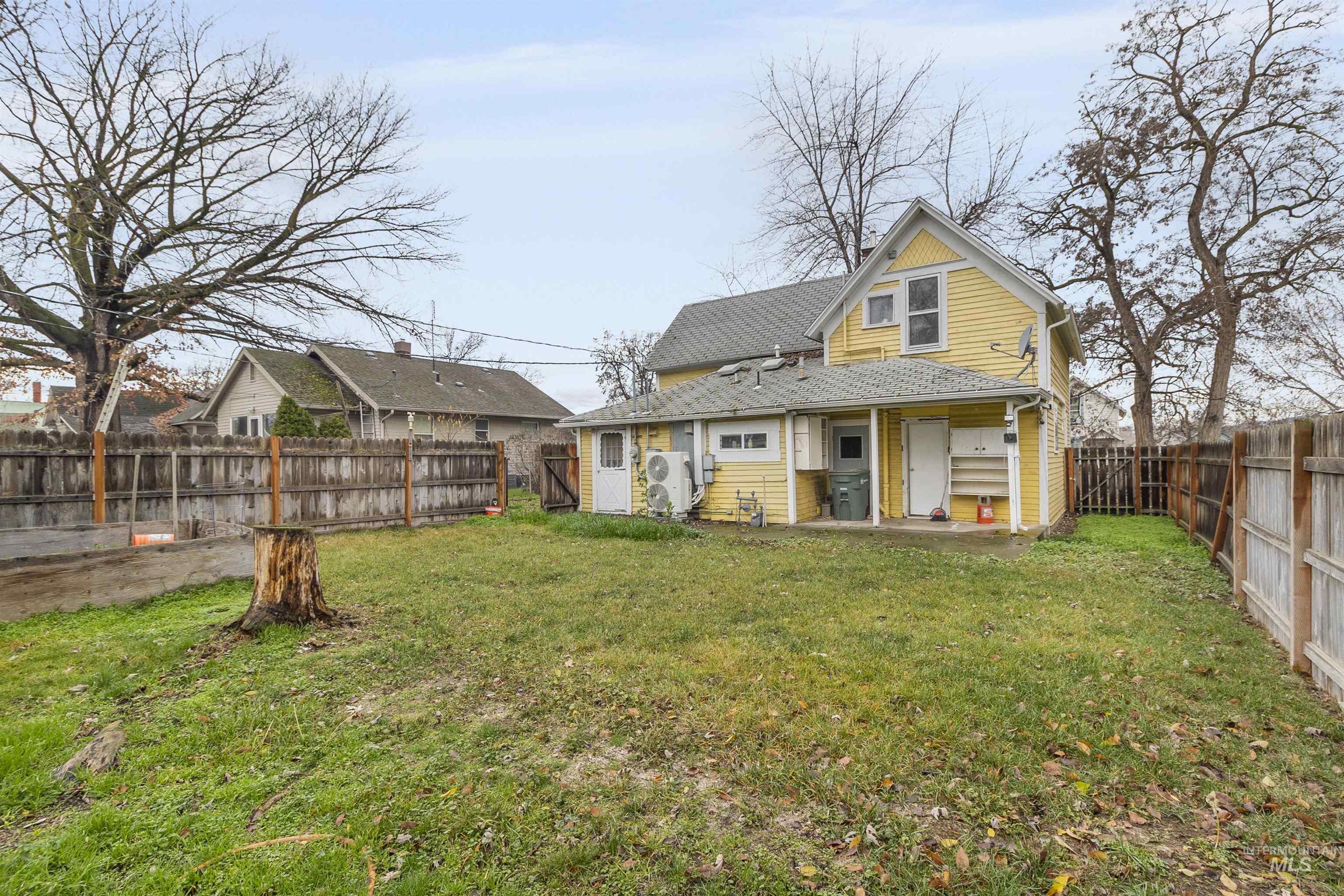 721 9th Street Clarkston, WA 99403 - Photo 5 of 39 Back of property with a fenced backyard and roof with shingles