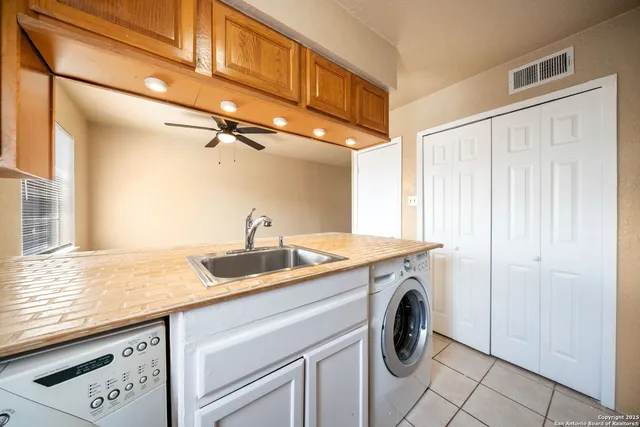 a utility room with closet dryer and washer