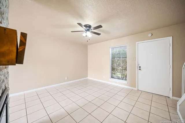 a view of an empty room and window