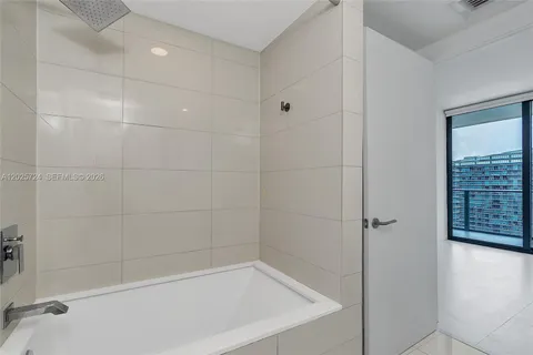 a bathroom with a double vanity sink and mirror