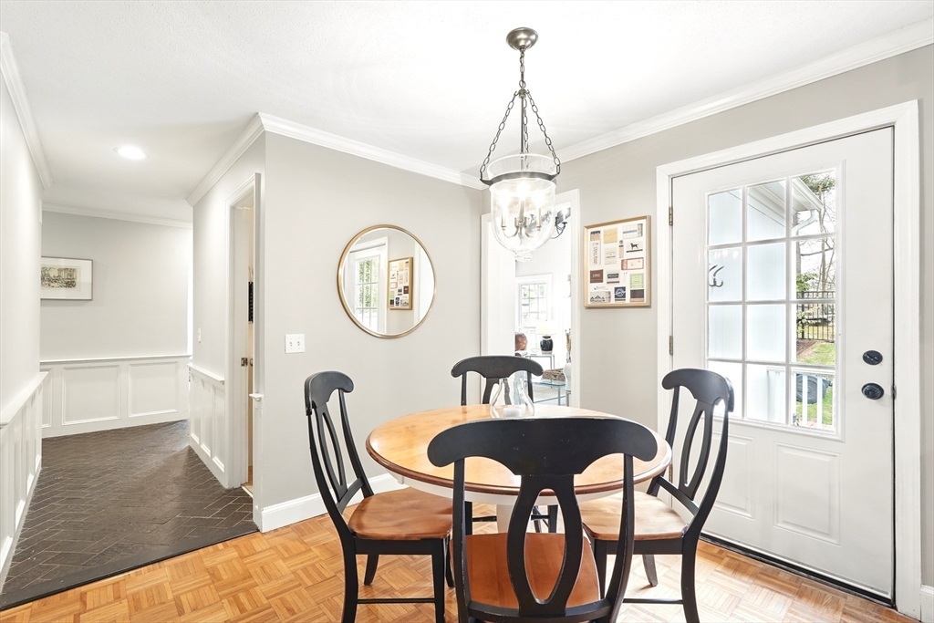 249 Concord Road Longmeadow, MA 01106 - Photo 15 of 41 a view of a dining room with furniture a chandelier and wooden floor