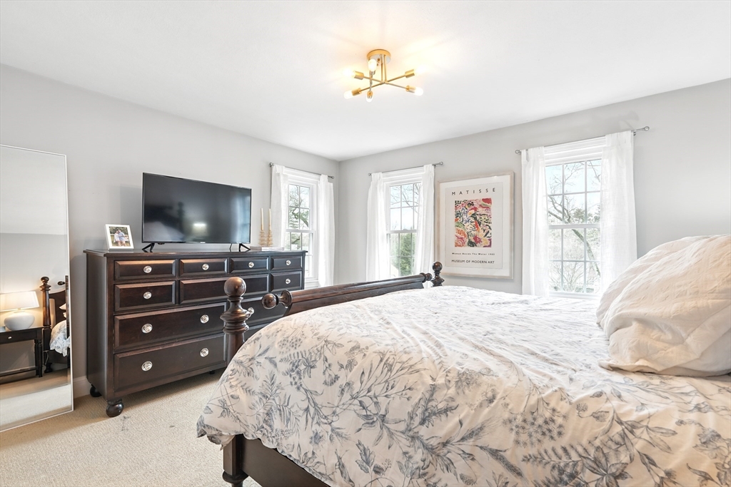 249 Concord Road Longmeadow, MA 01106 - Photo 32 of 41 a bedroom with a bed and a flat screen tv