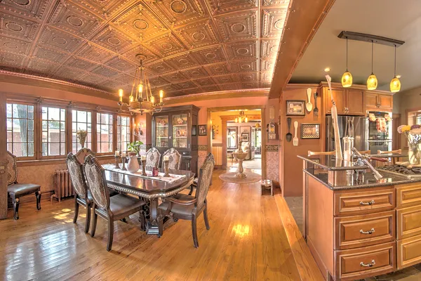 a kitchen with stainless steel appliances kitchen island granite countertop a stove and cabinets