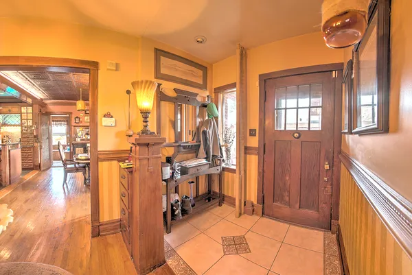 a dining room with furniture and wooden floor