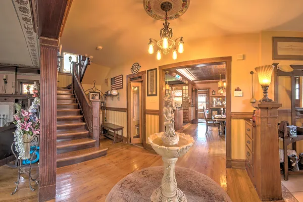 a dining room with furniture and wooden floor