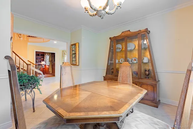 a room with wooden floor table and chair