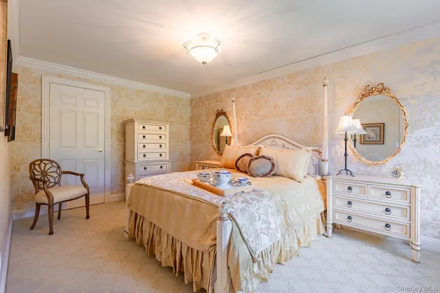 a bedroom with a bed a table and chair