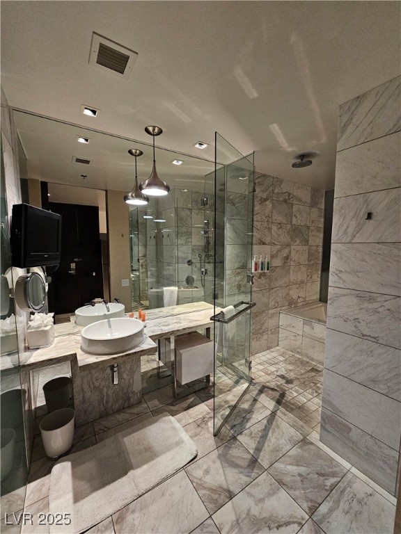 4381 West Flamingo Road, Unit 1806 Las Vegas, NV 89103 - Photo 12 of 12 Bathroom featuring vanity and a shower stall