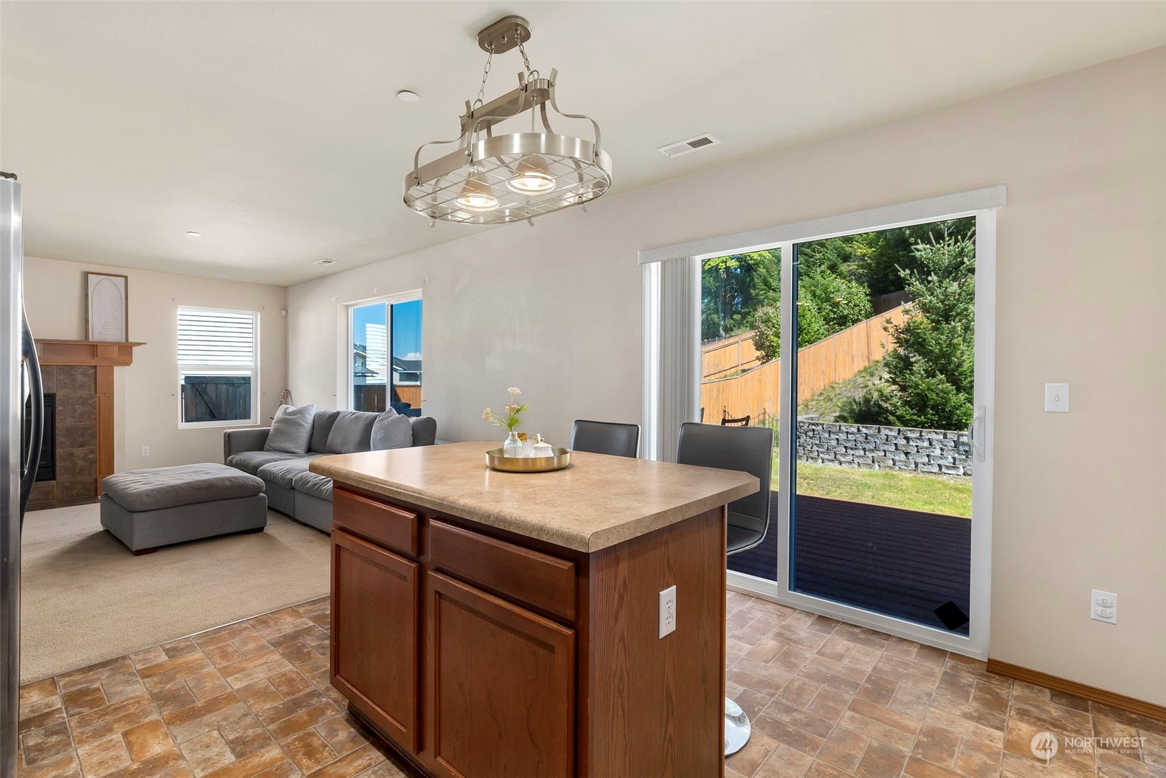 1332 Foreman Road DuPont, WA 98327 - Photo 13 of 32 a view of a kitchen area with furniture and windows