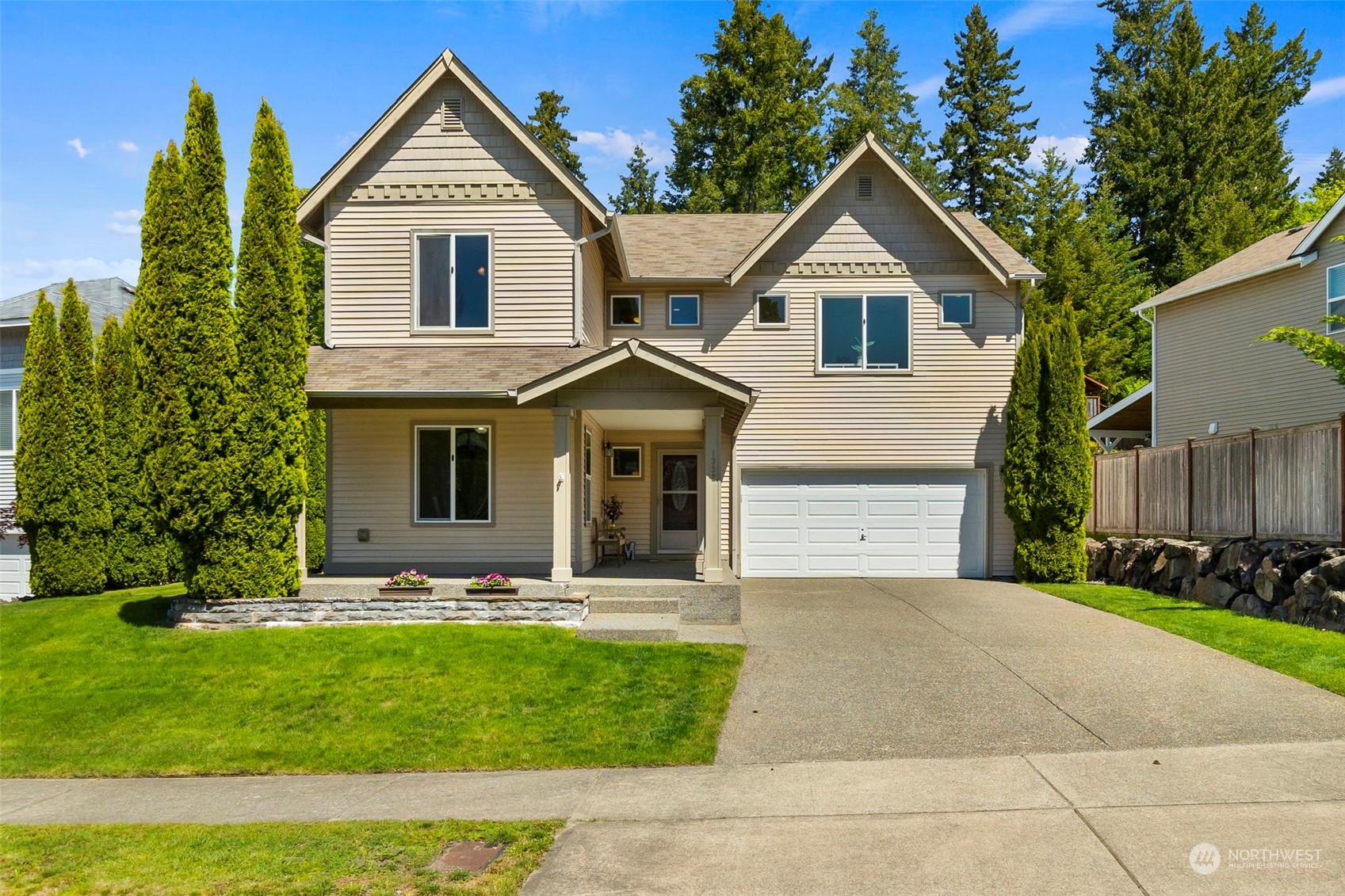 1332 Foreman Road DuPont, WA 98327 - Photo 2 of 32 a front view of a house with a yard and garage