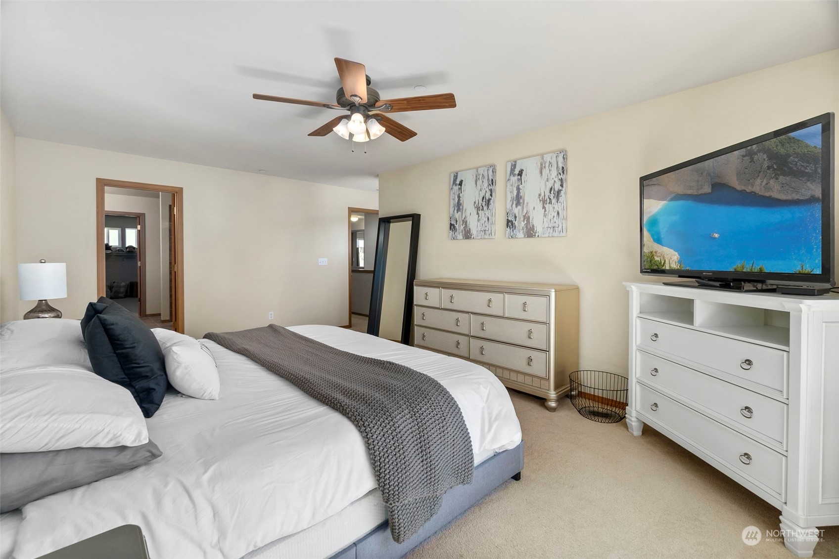 1332 Foreman Road DuPont, WA 98327 - Photo 24 of 32 a bedroom with a bed and a flat tv screen on dresser