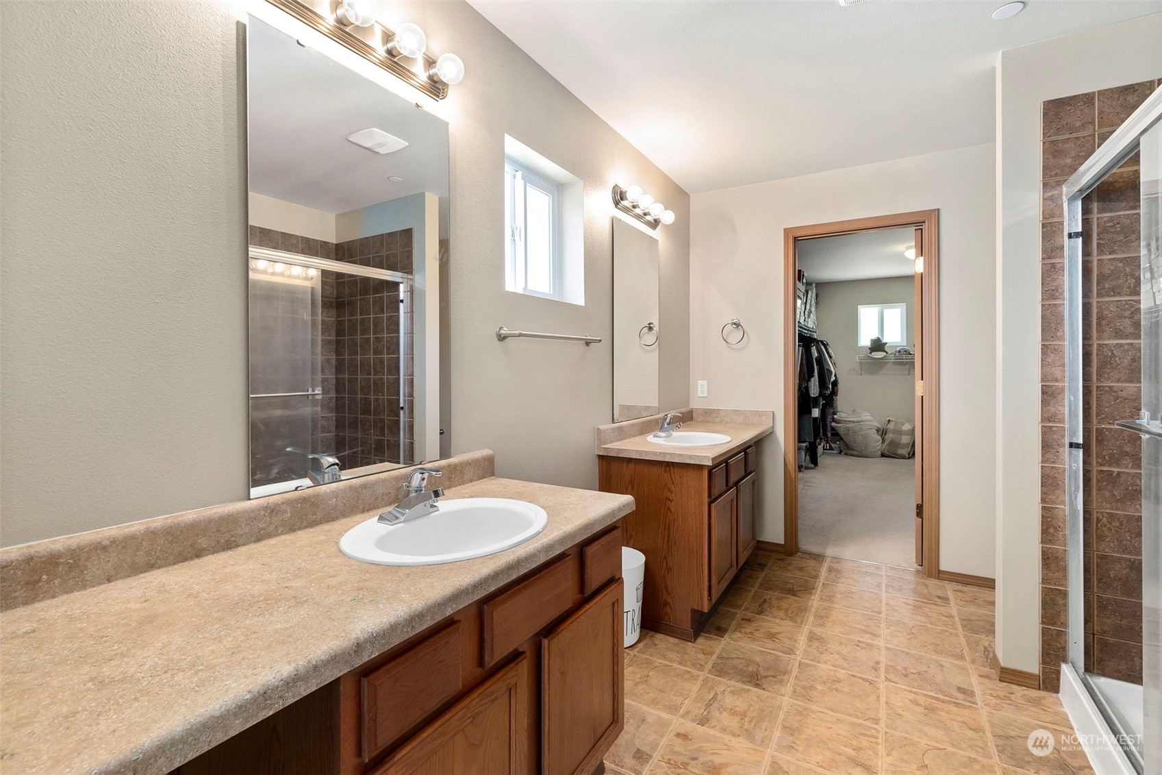 1332 Foreman Road DuPont, WA 98327 - Photo 25 of 32 a bathroom with a sink double vanity and a mirror