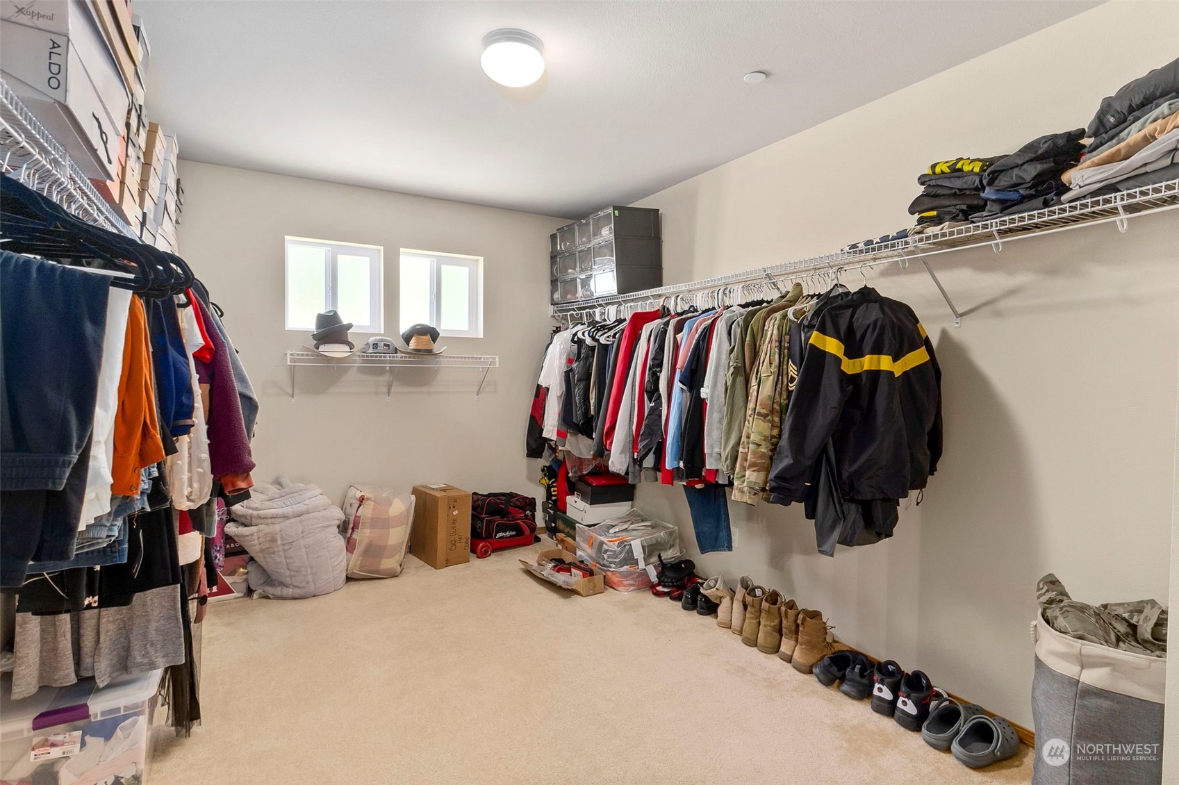 1332 Foreman Road DuPont, WA 98327 - Photo 27 of 32 a view of walk in closet with clothes and shoes