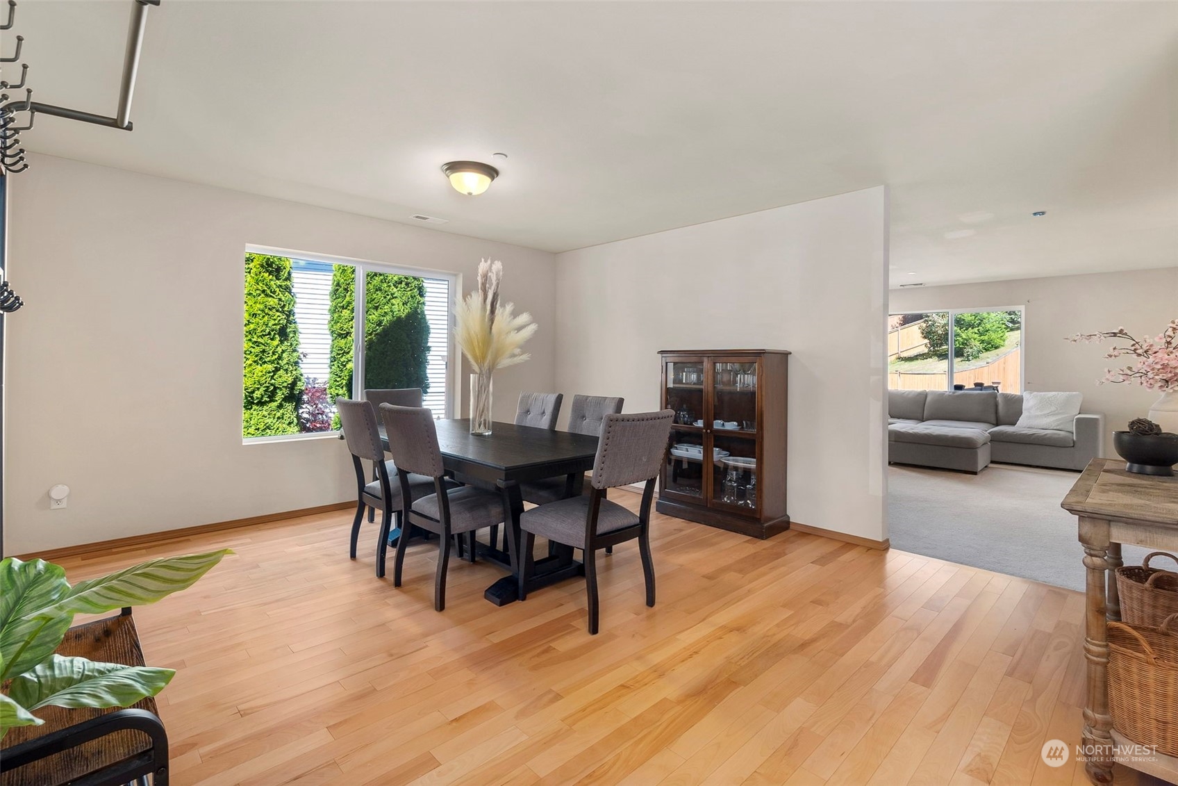 1332 Foreman Road DuPont, WA 98327 - Photo 8 of 32 a view of a dining room with furniture and wooden floor