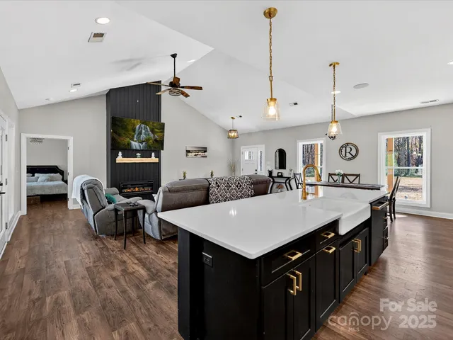 a large kitchen with a table and chairs