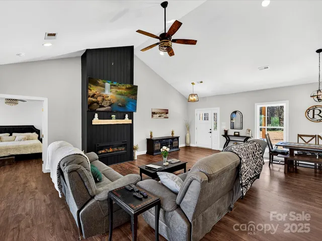 a bed room with furniture and a ceiling fan