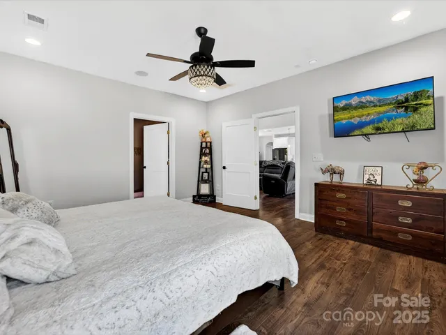 a bedroom with a bed and a dresser