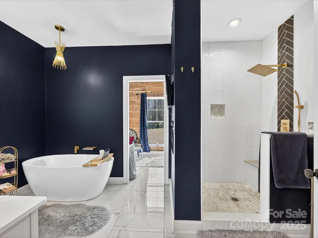 a bathroom with a bathtub and shower