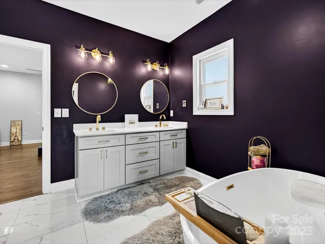 a bedroom with a bed and closet with mirror