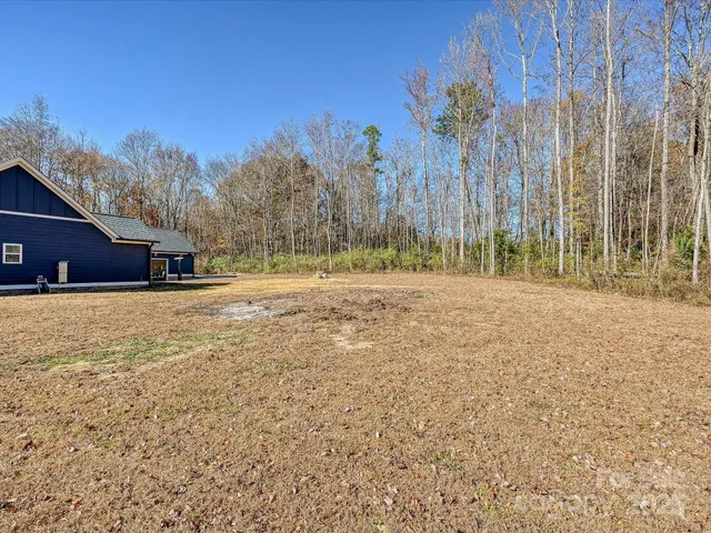 a backyard of a house with lots of green space