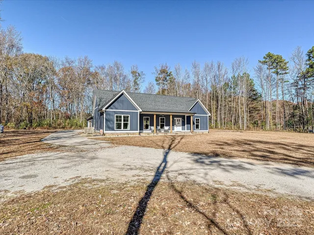 a house with trees in the background