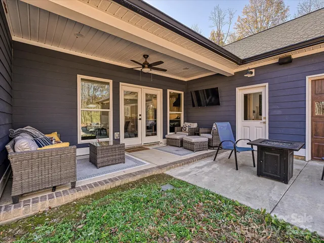 a outdoor living space with furniture and a potted plant