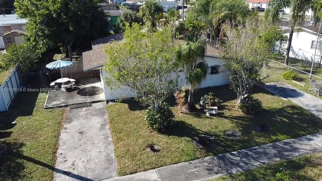 a backyard of a house with lots of green space