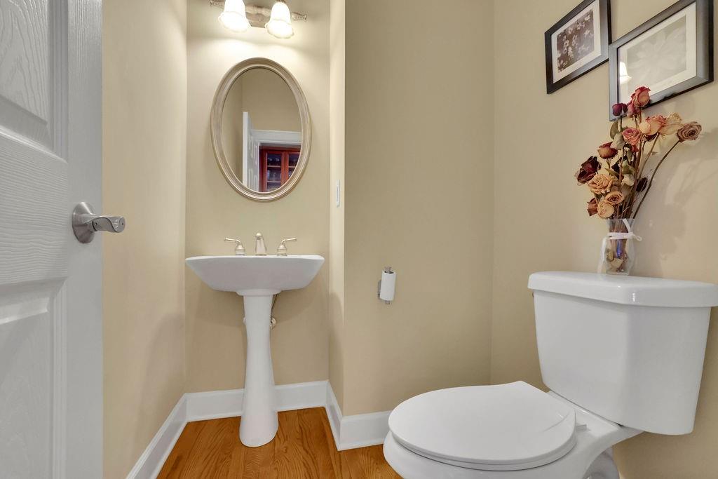 100 Trowbridge Road Atlanta, GA 30350 - Photo 12 of 49 a bathroom with a sink a mirror and a toilet