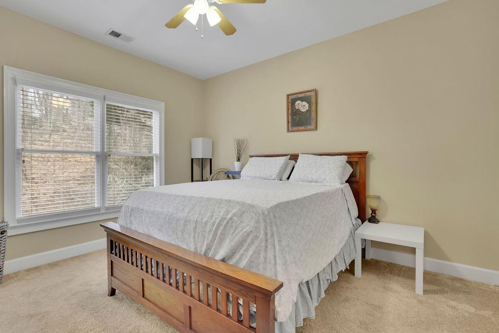 100 Trowbridge Road Atlanta, GA 30350 - Photo 18 of 42 a bed sitting in a bedroom next to a window