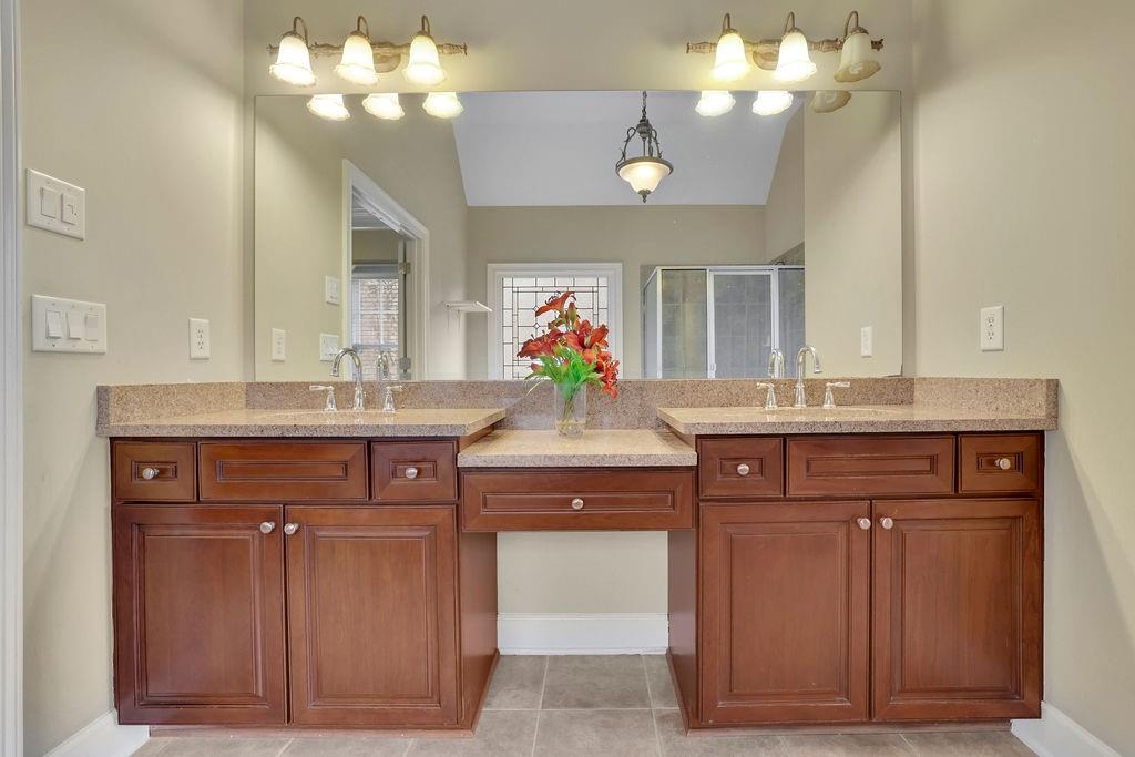 100 Trowbridge Road Atlanta, GA 30350 - Photo 23 of 49 a bathroom with a sink and a mirror