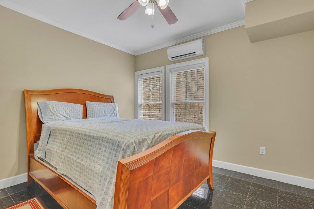 100 Trowbridge Road Atlanta, GA 30350 - Photo 33 of 49 a bed sitting in a bedroom next to a window