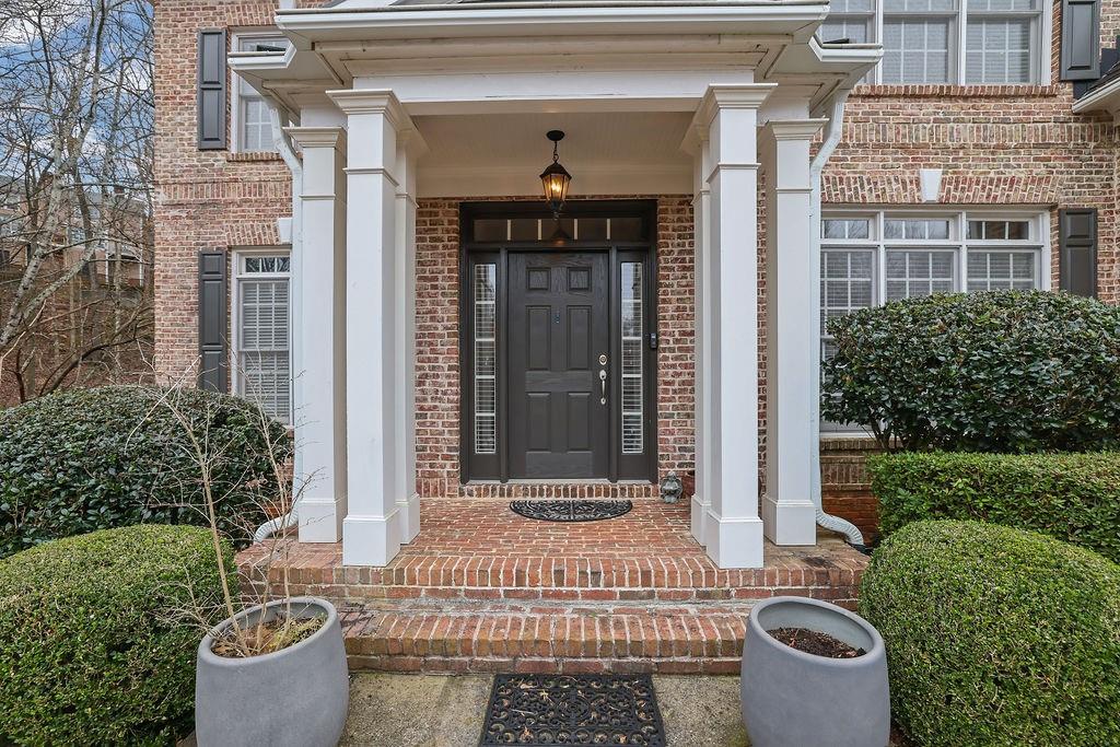 100 Trowbridge Road Atlanta, GA 30350 - Photo 7 of 49 a front view of a house with a garden