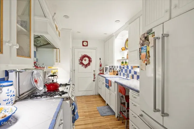 a kitchen with a stove and a sink