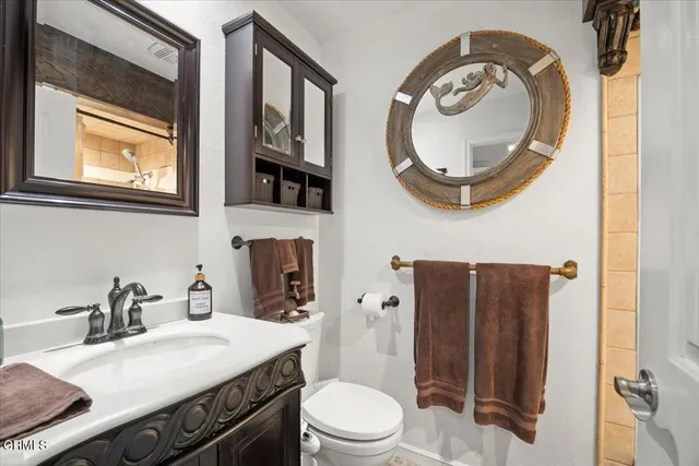 a large bed sitting in a bedroom next to a window